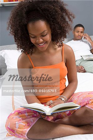 Woman Reading in Bed