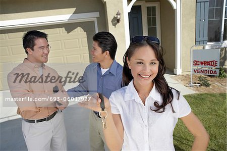 Couple with keys to new home