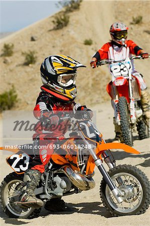 Young motocross racer in desert