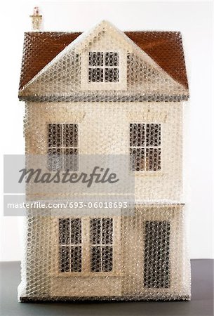 Model of house wrapped in bubble wrap