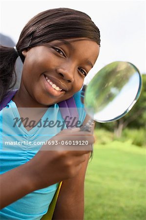 Girl Using Magnifying Glass