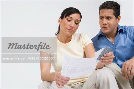 Couple Looking at Credit Card Bill
