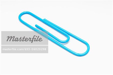 Blue paper clip on white background