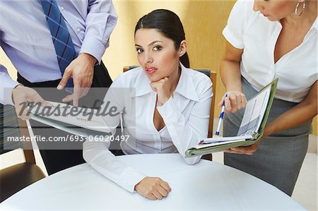Business woman working with colleagues in office