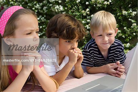 Shocked Little Kids Looking at a Laptop