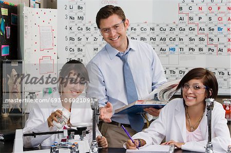 Science Teacher Helping Student