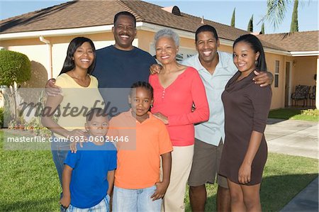 Family outside house, portrait