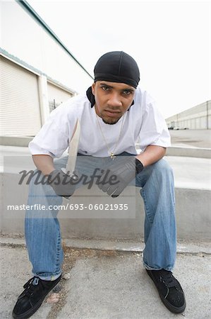 Young man posing with knife