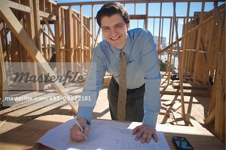 Site manager with building plans