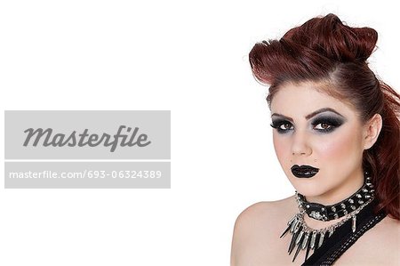 Close-up portrait of a punk woman over white background