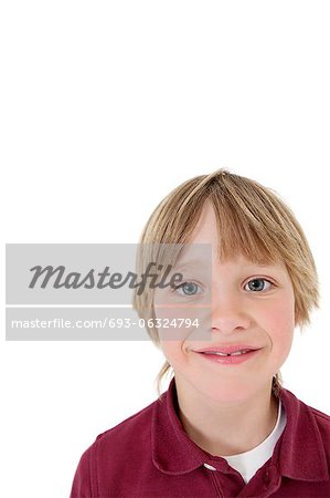Close-up portrait of a school boy over white background
