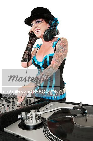 Happy tattooed DJ over white background