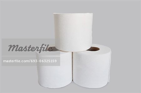 Close-up view of toilet paper stack on white background