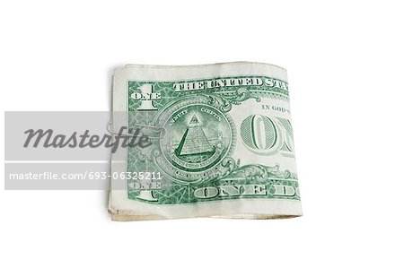 Close-up of paper dollars in clip over white background