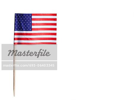 American flag in toothpick against white background