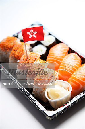 Sushi food on tray with Hong Kong flag against white background