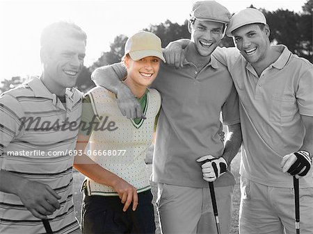 Portrait of four young friends at golf course