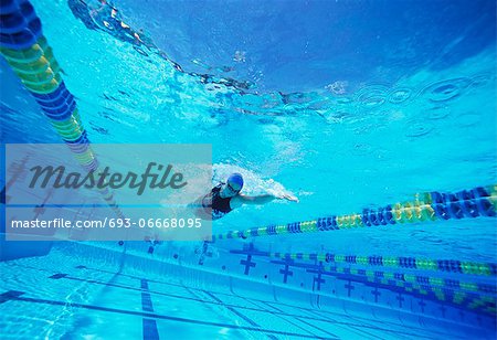 Young female swimmer in competition