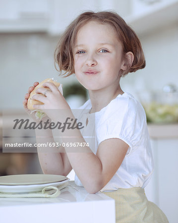 Beautiful Young Girl eating sandwich