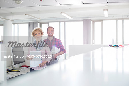 Portrait of confident business people standing in office