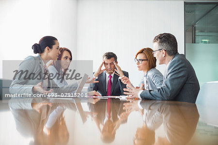 Businesspeople arguing in meeting Businesspeople arguing in meeting
