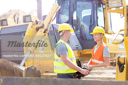 Engineers discussing at construction site