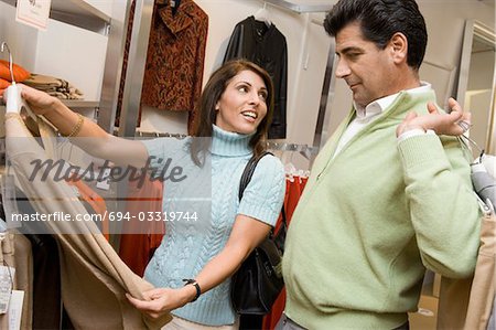 Couple clothes shopping together