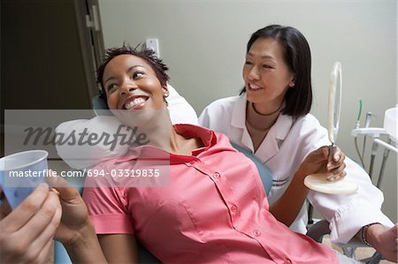 Woman with dentist in surgery