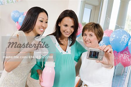 Women at a Baby Shower using Digital camera