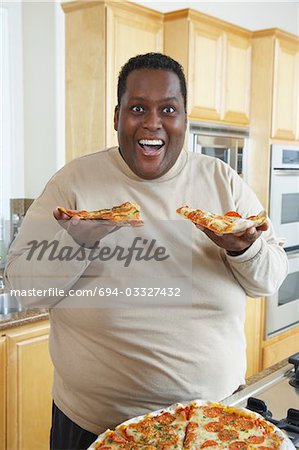 fat dude eating pizza