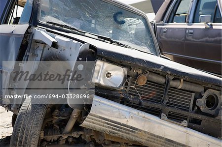 Damaged car in junkyard