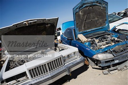 Damaged cars in junkyard