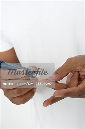 Man taking syringe from protective case, close-up of hands