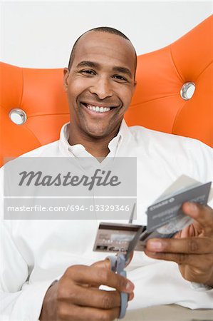 Man Cutting up Credit Cards