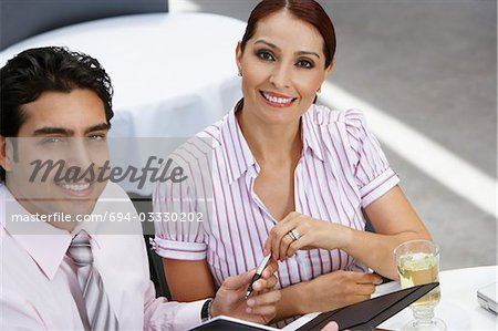 Business woman and business man, portrait