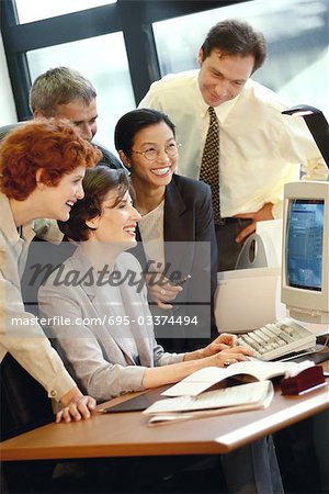 Group of businesspeople working together at desk