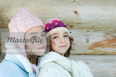 Two young friends smiling at camera, portrait