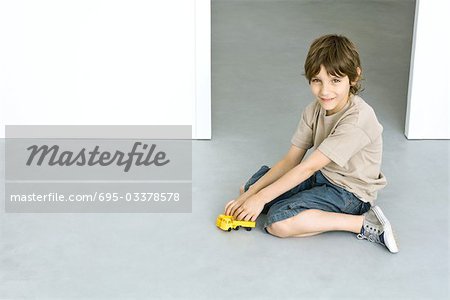 Little Boy Playing with Color Toys on Floor Stock Photo - Image of  bulldozer, little: 19039326