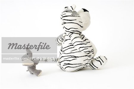 Stuffed toys, elephant pulling tiger's tail