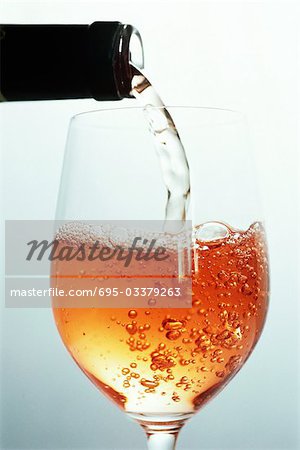 Rose wine being poured