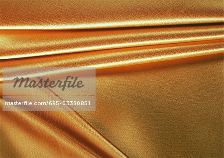 Folded gold fabric, close-up, full frame