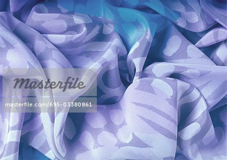 Folds in patterened fabric, close-up, full frame