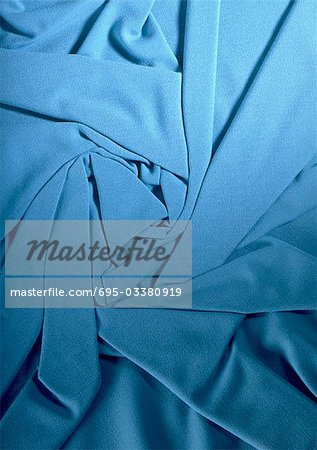 Folded blue fabric, close-up, full frame
