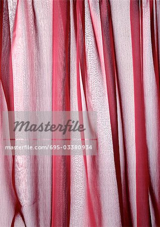 Folds in sheer red fabric, close-up, full frame