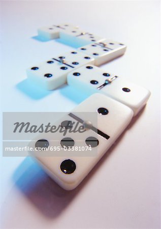 Dominoes on white surface, close-up