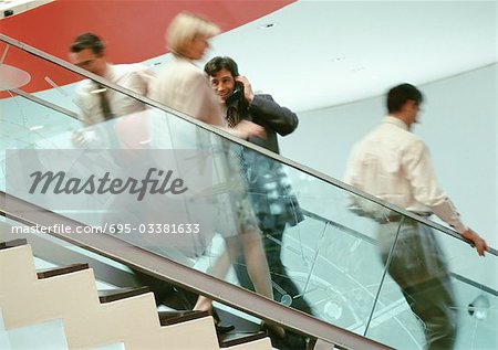Business people on stairs, blurred
