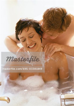 Woman taking bath, man massaging her shoulders - Stock Photo - Masterfile -  Premium Royalty-Free, Code: 695-03381849