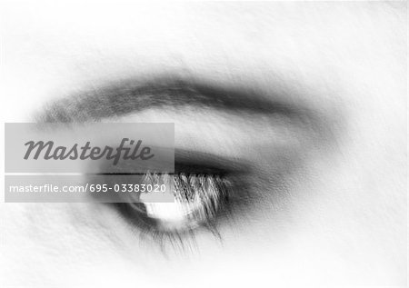 Woman's eye, blurred close up, black and white.