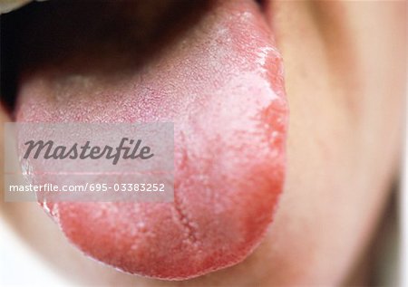 Close up of woman sticking tongue out.