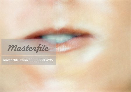 Close up of woman's mouth making expression.
